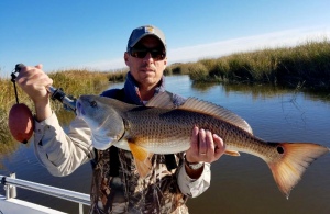 Rob Payne with a large red caught on 1/8oz. jig.