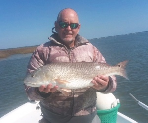 Capt. Jack with a nice winter time red. Pitching plastics on the flats.