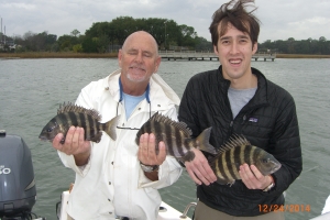 Capt Jack and Brain Mason (iron fist, velvet glove) catching sheepshead with his folks! Nice bite during changing weather!