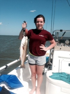 Niki fishing with her anunt and uncle Al & Kim Sims with a nice red!