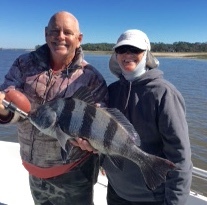 Sally Bailey catching and releasing a large black drum.