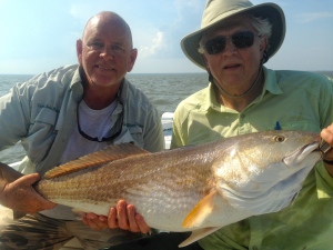 Capt. Jack and Peter Roberts with a large reddrum