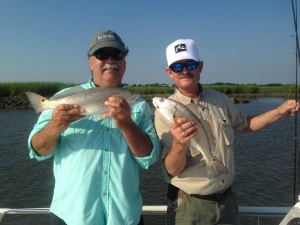 Capt. Jackie and Bobby King with a couple of nice schoolie reds!