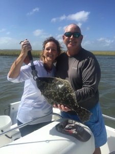 Donna Rooney with a nice flounder! Jim & Donna caught several schoolie reds on windy day with high tides.