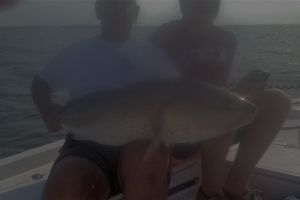 Capt. Jack & Will with a large red drum!