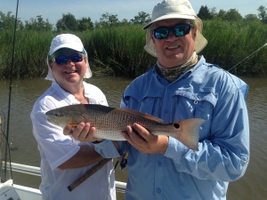 Michael Denmark and his Laird Miller catching some nice reds! Hot day but good fishing!