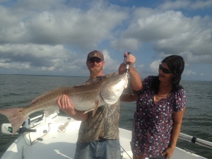 Ryan "catfish" Sidwell and his wife Carlita with a large red drum!