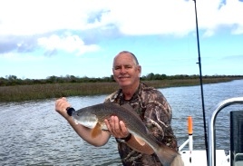Capt.Jack with an afternoon redfish.