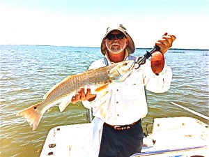 A nice day catching with Bill Johnston and Alex Cathy! Alex is shown here with 28" red! Redfish bite is on! Fish On!