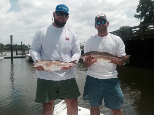 Matt and Clay Kizzire with a couple of nice schoolie reds!