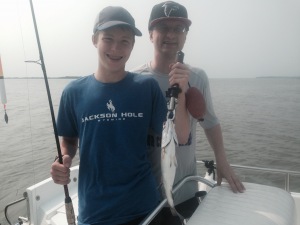 Rick Talbott and his son Ryan having fun catching a variety of fish! Ryan holding up a nice trout!