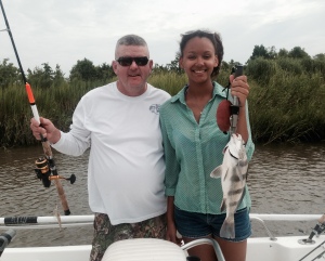 Mac Center with his daughter Michaela. Michaela is holding a nice black drum.