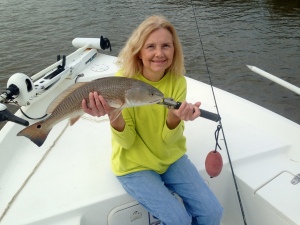 Cathy with a nice redfish! She caught and released several schoolie redfish! Nice fish on a light bite.