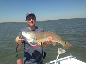 Oren Chaimovitch with large redfish catch under a DOA popping lloat with a mud minnow!