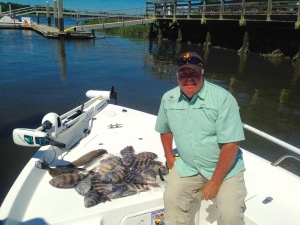 Tom Davis with a nice mess of sheepshead, red drum & lone flounder. Nice catch!