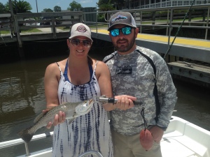 Tony and his wife with a nice seatrout she caught on a shrimp.