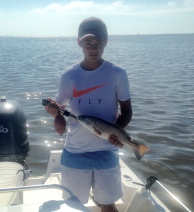 Adam Pierce's newphew with a nice redfish! Lots of just undersized fish released.