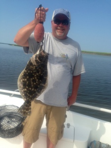 Josh Dick with a 5 lb. flounder! Josh and Kevin caught a summer time variety of redfish, black drum and flounder. Josh's large flounder was caught on a bugged out shrimp.