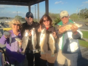 Gail, Mitch, Rose & Carl catching some reds and seatrout on a windy afternoon!