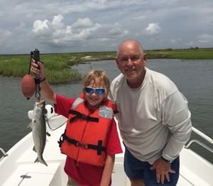 Grayson Binns and Capt. Jack. Grayson is holding a nice seatrout.