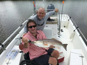 Robert with a large redfish! Pitching plastics for some reds!