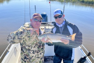 Robert Troeller & brother in law Jeff.  Jeff is holding a nice red!