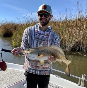 Nate Martinez with a nice red!  He and his family were on good redfish bite!