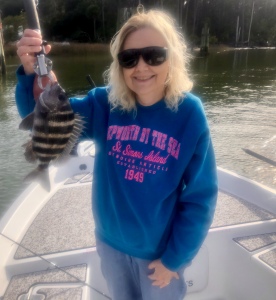 Cathy & Jack catching & releasing some sheepshead.