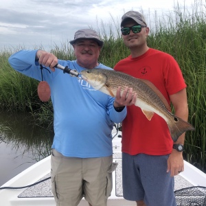 Vincent Young with son Elliot catching some reds!