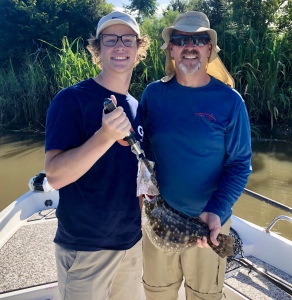 Spenser & (dad) Glenn Redelman with a nice flounder.